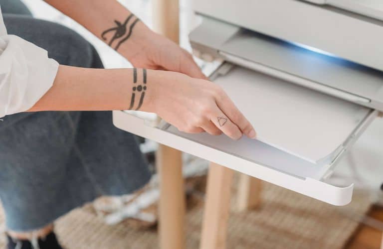 loading paper into at home office printer for a cost-effective printable project