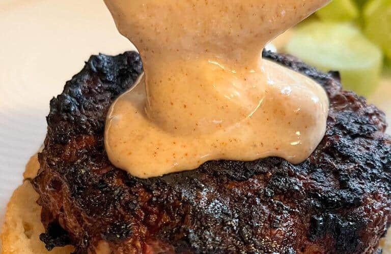 sauce drizzled over a burger
