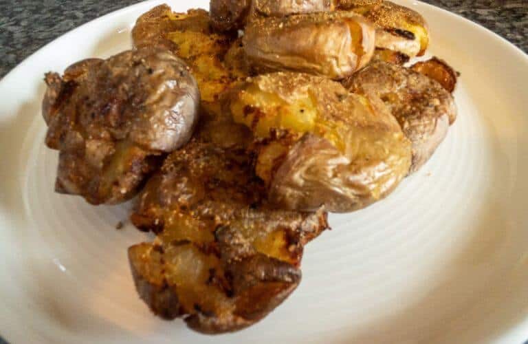 crispy potatoes on a white plate