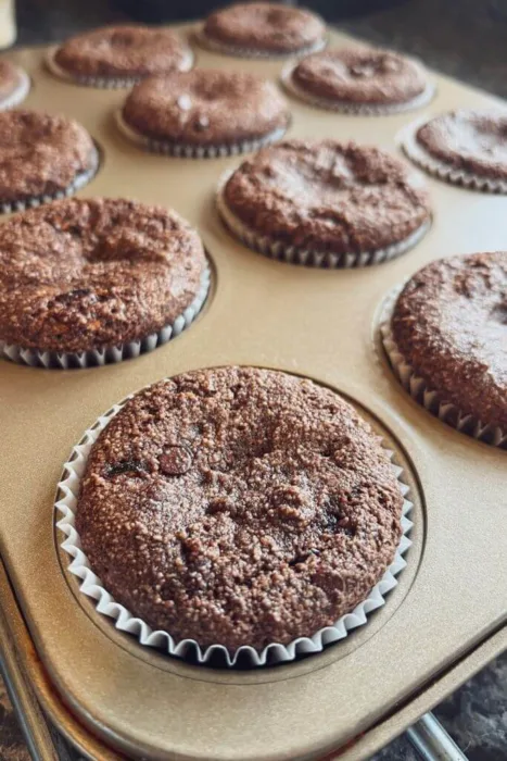 almond flour chocolate chip zucchini muffins cupcakes in a muffin pan