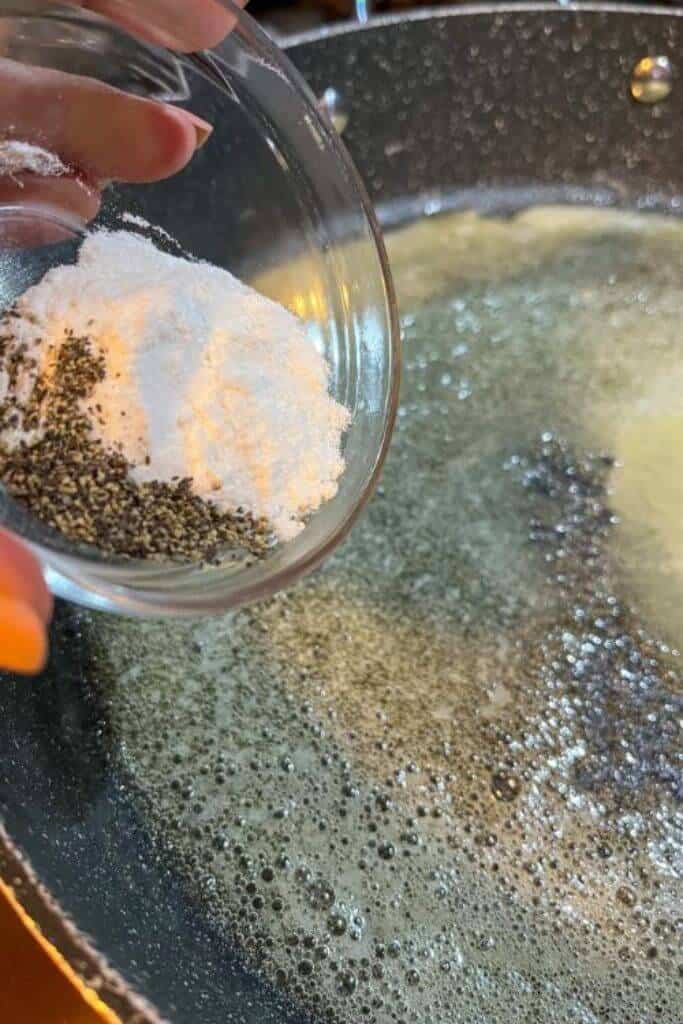 wheat free rice flour being added to melted butter in a pan