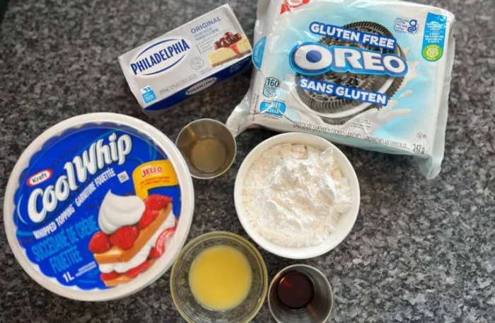 representation of a gluten-free, no-bake Oreo cheesecake bites recipe ingredients, showcasing the perfect blend of textures and flavors