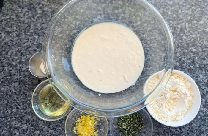 Ingredients for gluten-free lemon rosemary sourdough discard crackers laid out on a kitchen counter