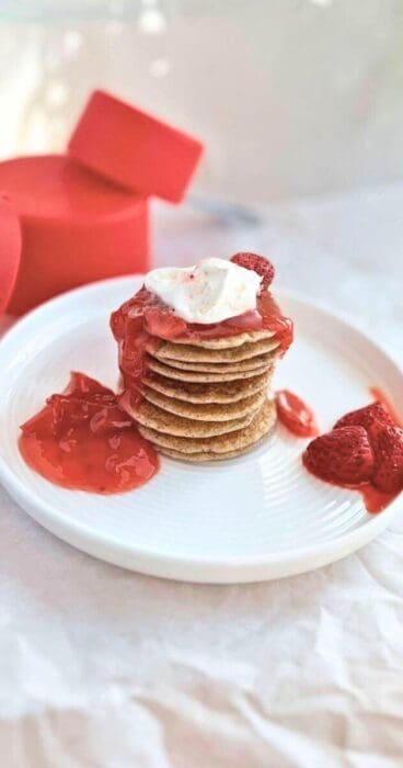 Stack of sourdough discard pancakes topped with fresh berries