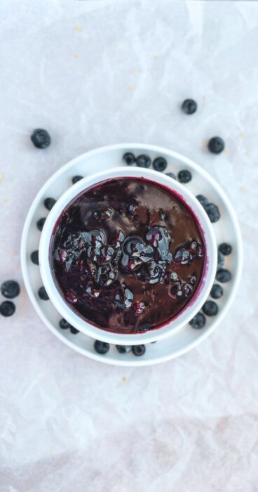 A bowl of blueberry topping, catering to gluten-free and dairy-free needs.