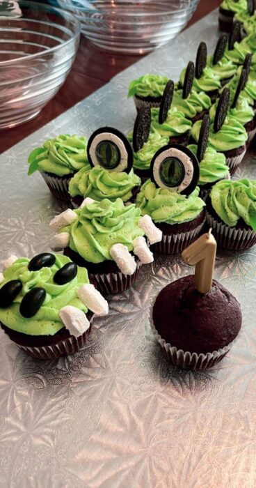 An impressive dessert centerpiece showcasing an alligator cupcake cake adorned with sugary sweet details.