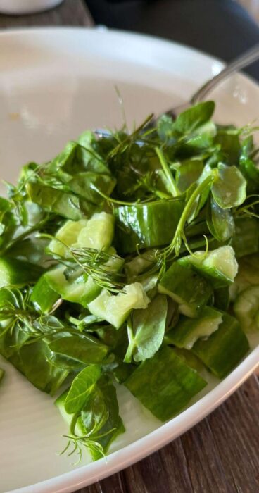 Cucumbers gently smashed and mixed with zesty dill, perfect for a gluten-free salad.