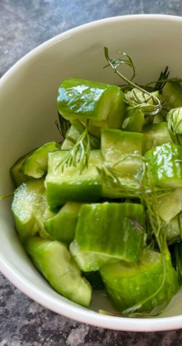 Textured cucumber pieces mixed with fragrant dill, creating a delightful gluten-free salad.