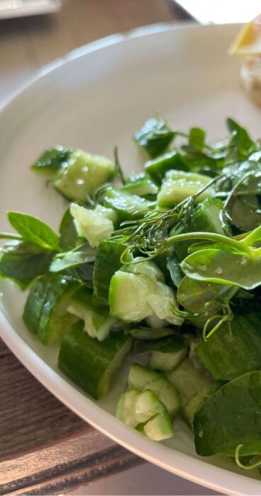 Crisp cucumbers smashed and tossed in a gluten-free salad, accentuated with aromatic dill and green pea shoots.